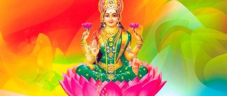 Goddess of prosperity Lakshmi sits in a lotus